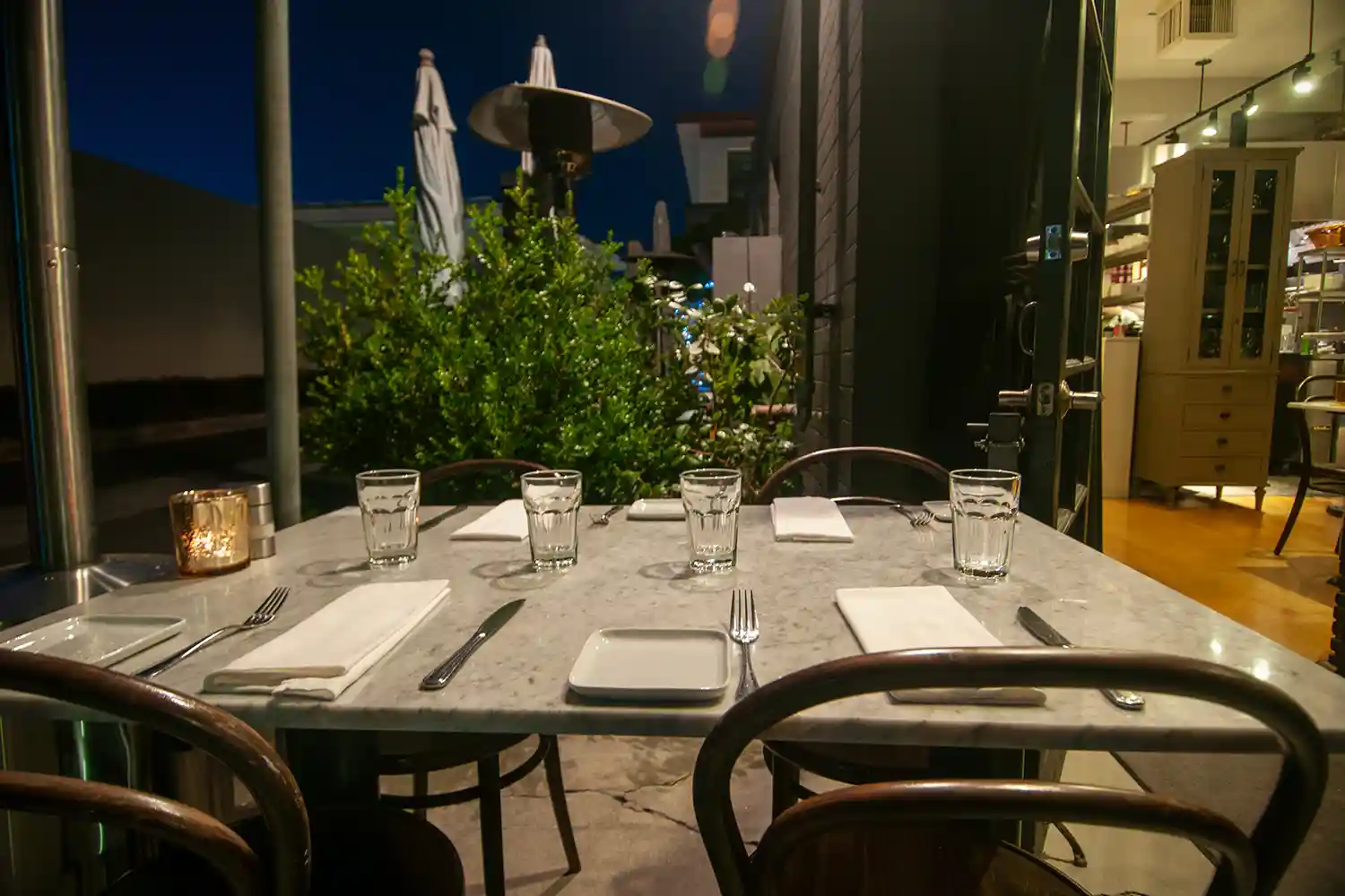 Set tables on front patio of Bistro Elan - thumb